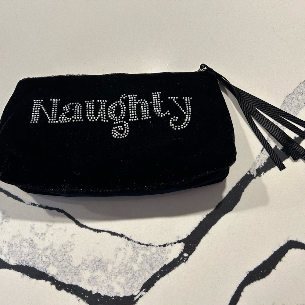 A fun little velvet bag with small bling beads in the front and back.